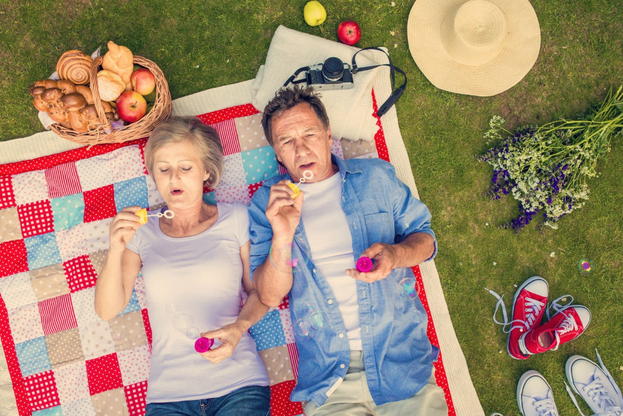beautiful-seniors-having-a-picnic-in-nature