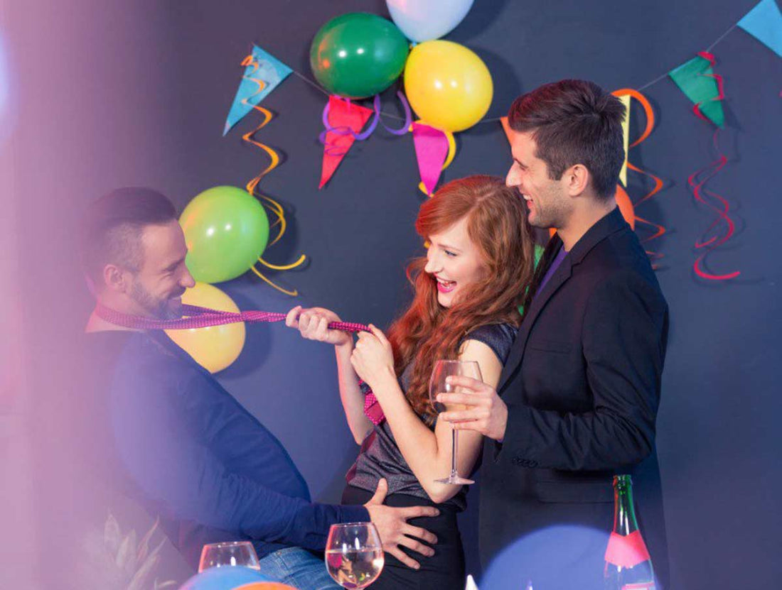 two young man surrounding a young woman in a playful way and teasing her and flirting with her 